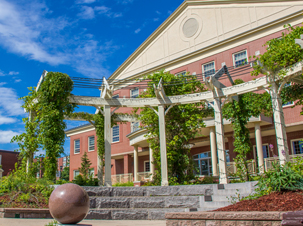 A photo of upper campus featuring the pergola with Brian Mulroney Hall in the background
