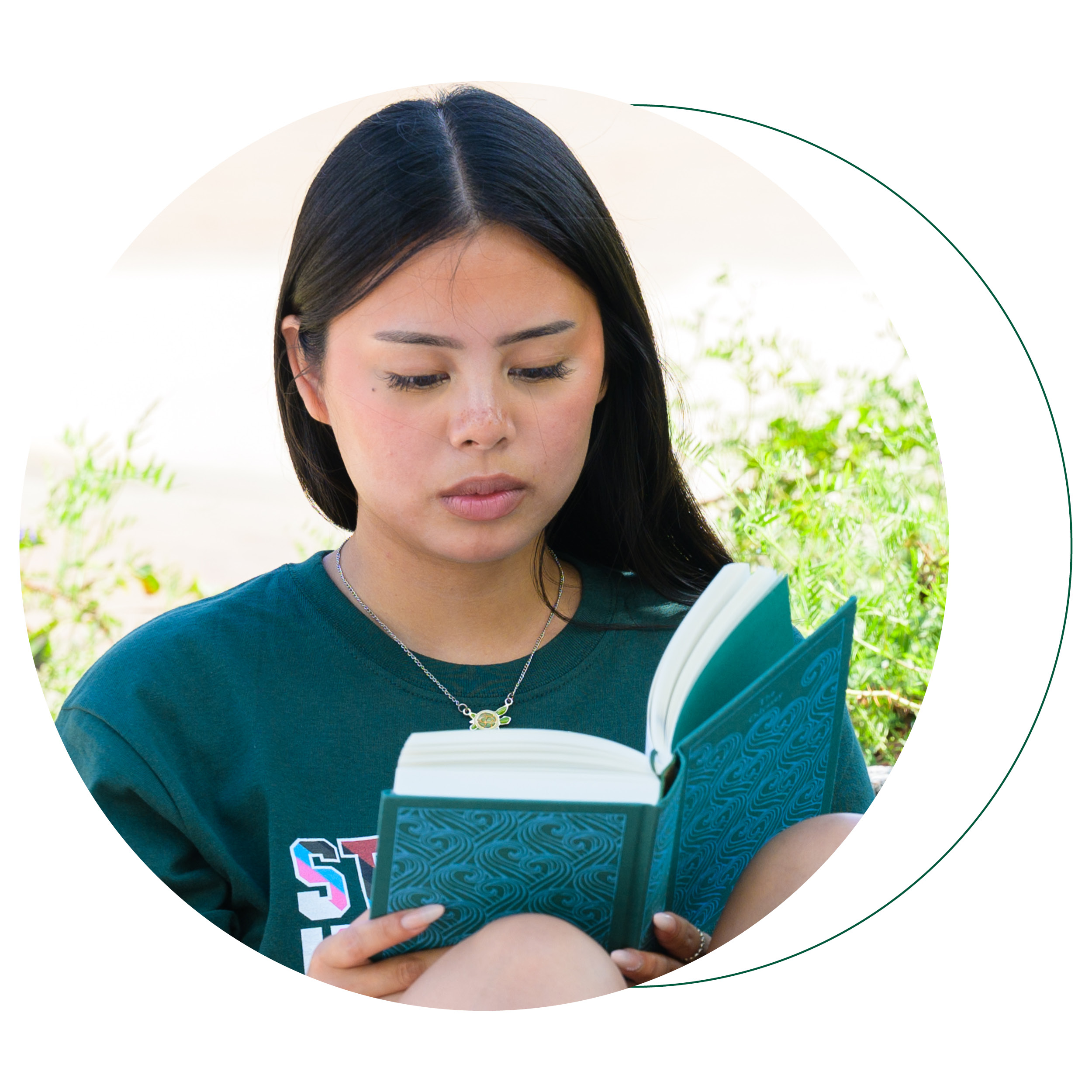 circle photo of a student reading a book